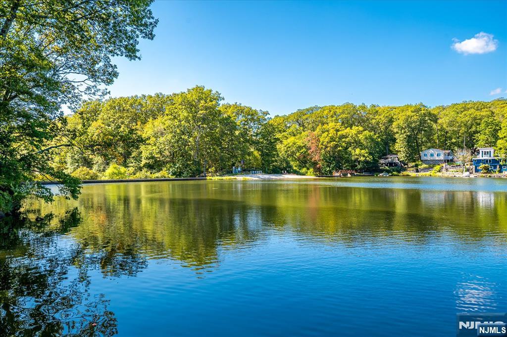 177 Otterhole Road West Milford, NJ 07480 - Photo 44 of 49 a view of a lake with a building in the background