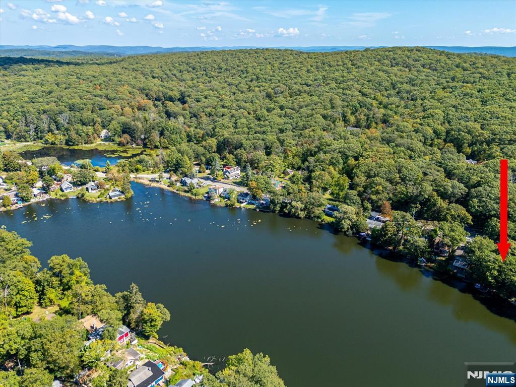 177 Otterhole Road West Milford, NJ 07480 - Photo 46 of 49 a view of a lake with a building in the background