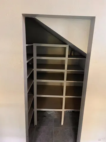 a view of a livingroom with a staircase