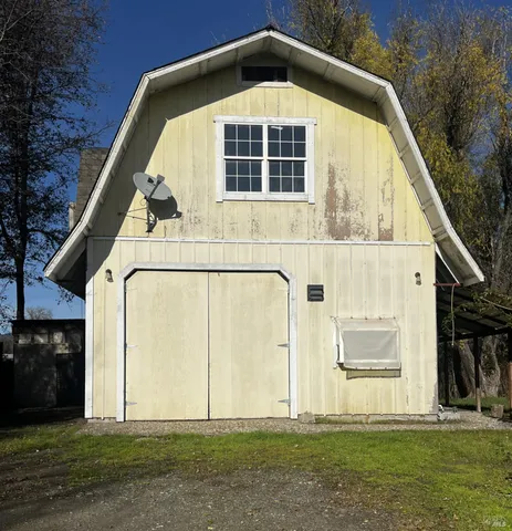a view of a kitchen with a refrigerator and a sink