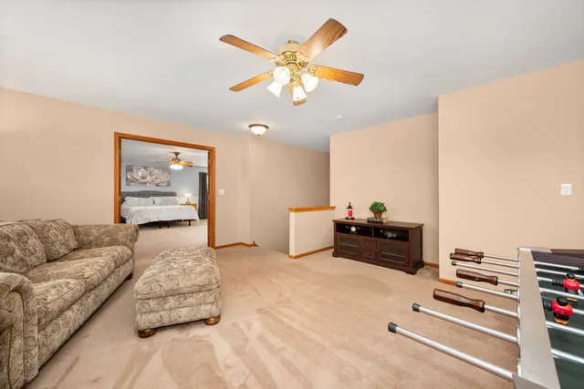 a spacious bedroom with a bed and a table