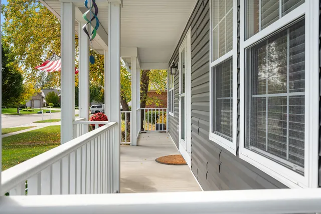 a view of balcony with floor to ceiling windows and yard