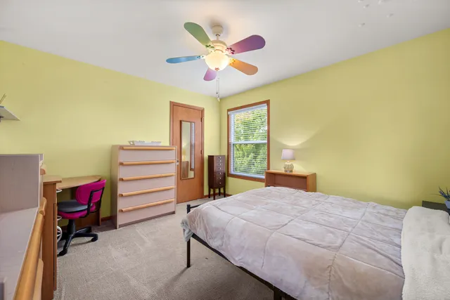 a bathroom with a double vanity sink toilet and a mirror