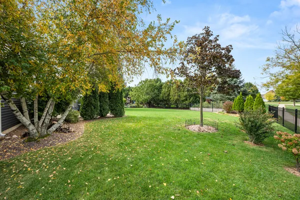 a backyard of a house with lots of green space