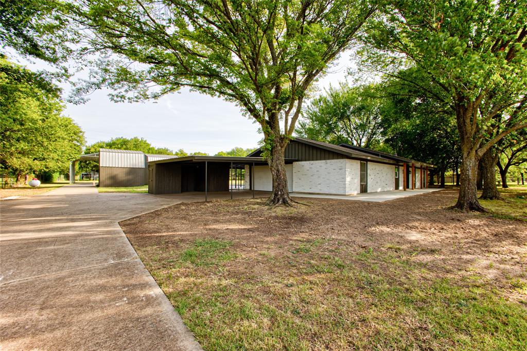 206 Americana Road Palmer, TX 75152 - Photo 3 of 40 A More Narrowed View Approaching up the Concrete Driveway