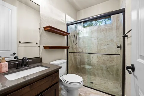 a bathroom with a sink double vanity and a mirror