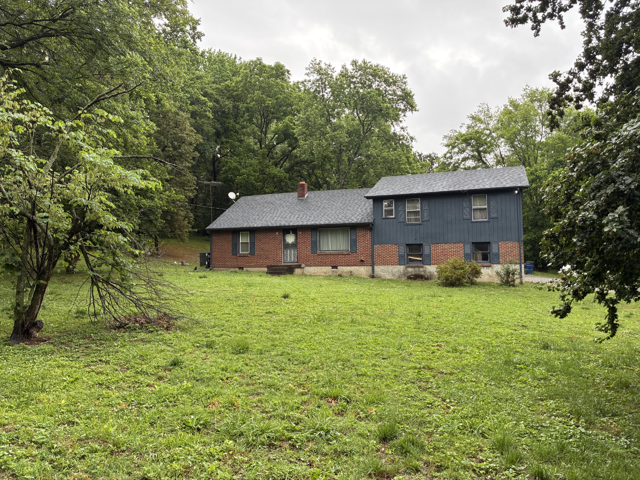 1083 Tulip Grove Road Hermitage, TN 37076 - Photo 4 of 9 a front view of a house with garden
