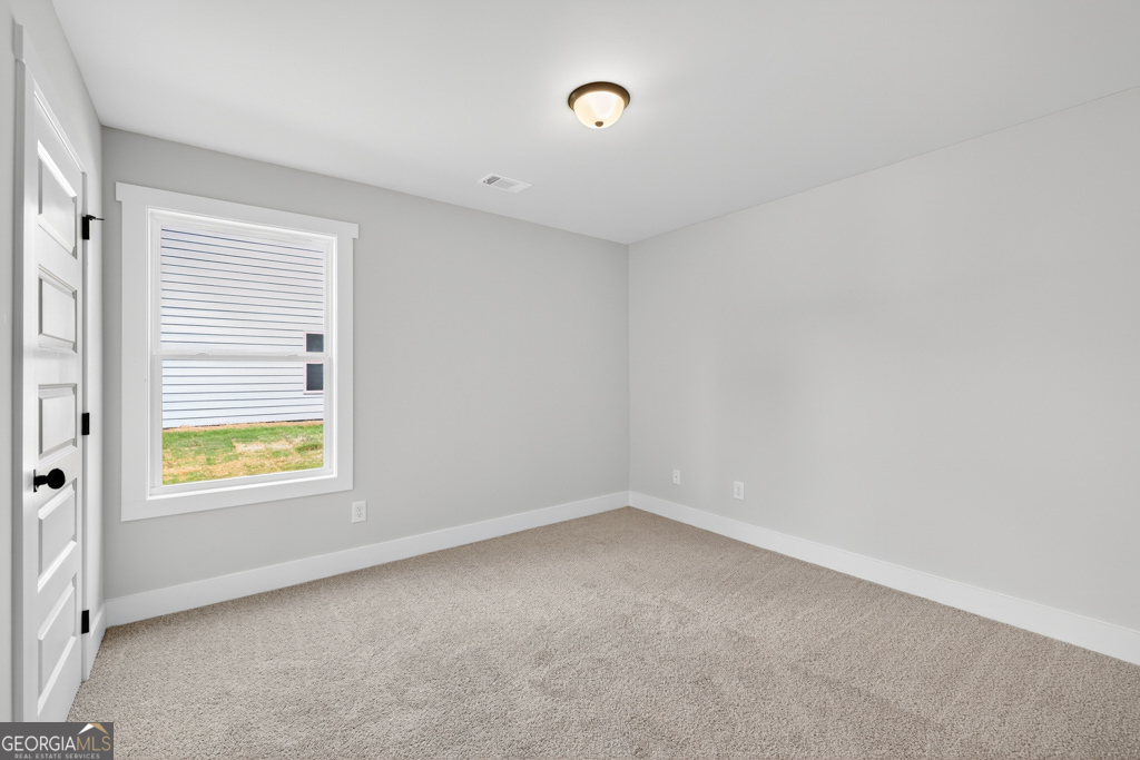 373 Liberty Hill Road, Unit 19 Hartwell, GA 30643 - Photo 18 of 31 an empty room with a window