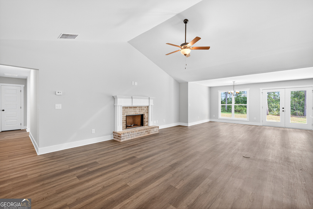 373 Liberty Hill Road, Unit 19 Hartwell, GA 30643 - Photo 5 of 31 a view of an empty room with window and wooden floor