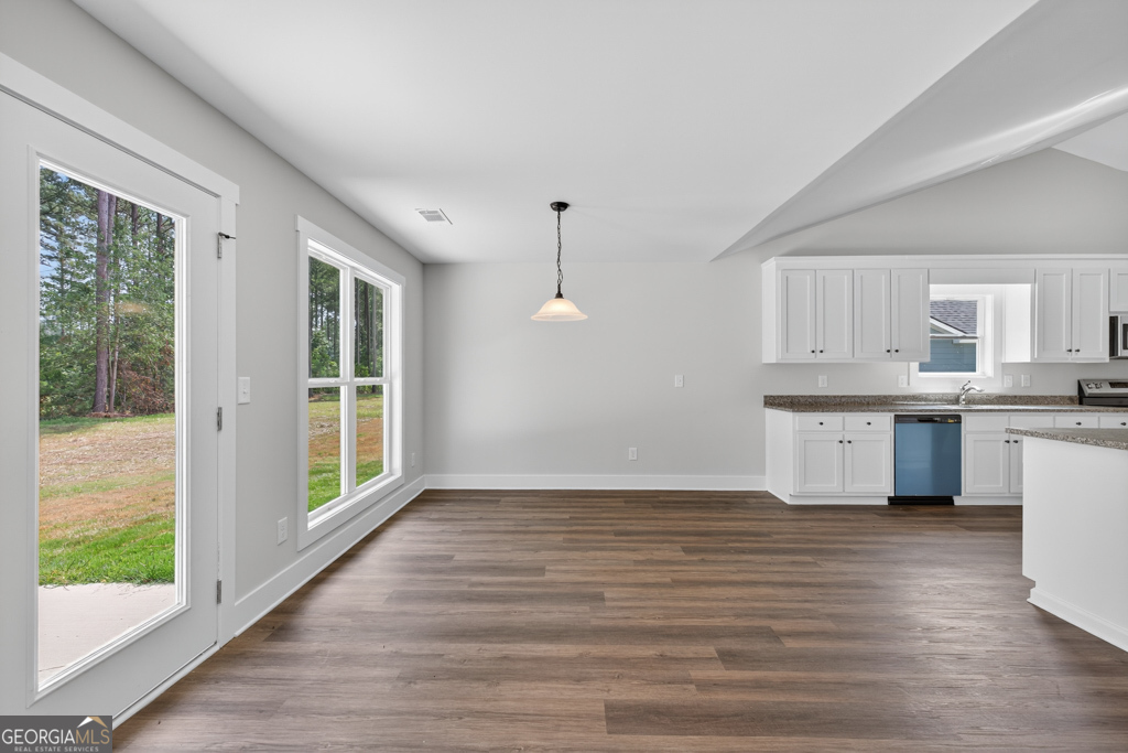 373 Liberty Hill Road, Unit 19 Hartwell, GA 30643 - Photo 8 of 31 a view of kitchen with granite countertop cabinets and wooden floor