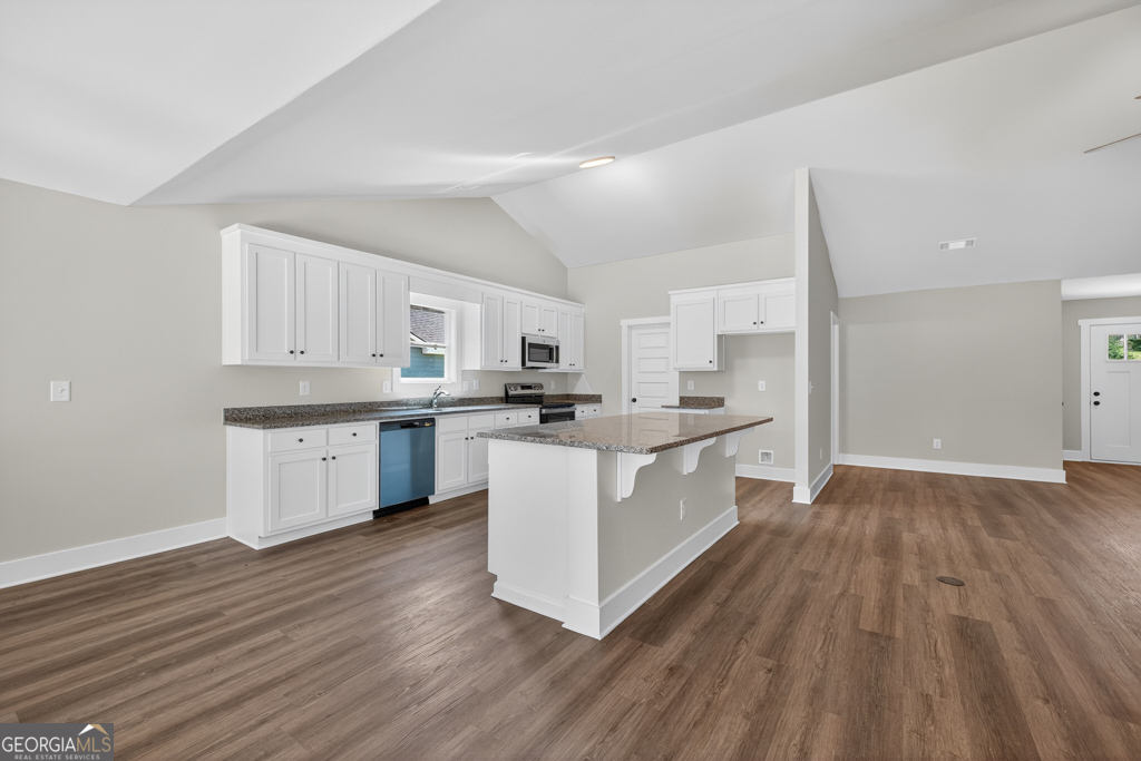 373 Liberty Hill Road, Unit 19 Hartwell, GA 30643 - Photo 9 of 31 a large kitchen with a lot of counter space and wooden floor