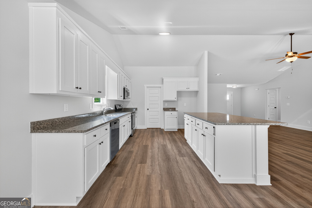 373 Liberty Hill Road, Unit 19 Hartwell, GA 30643 - Photo 10 of 31 a kitchen with granite countertop a sink and cabinets