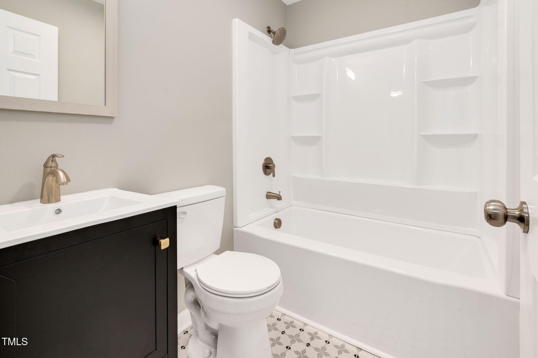 529 Solar Drive Raleigh, NC 27610 - Photo 11 of 18 a bathroom with a sink a toilet and shower