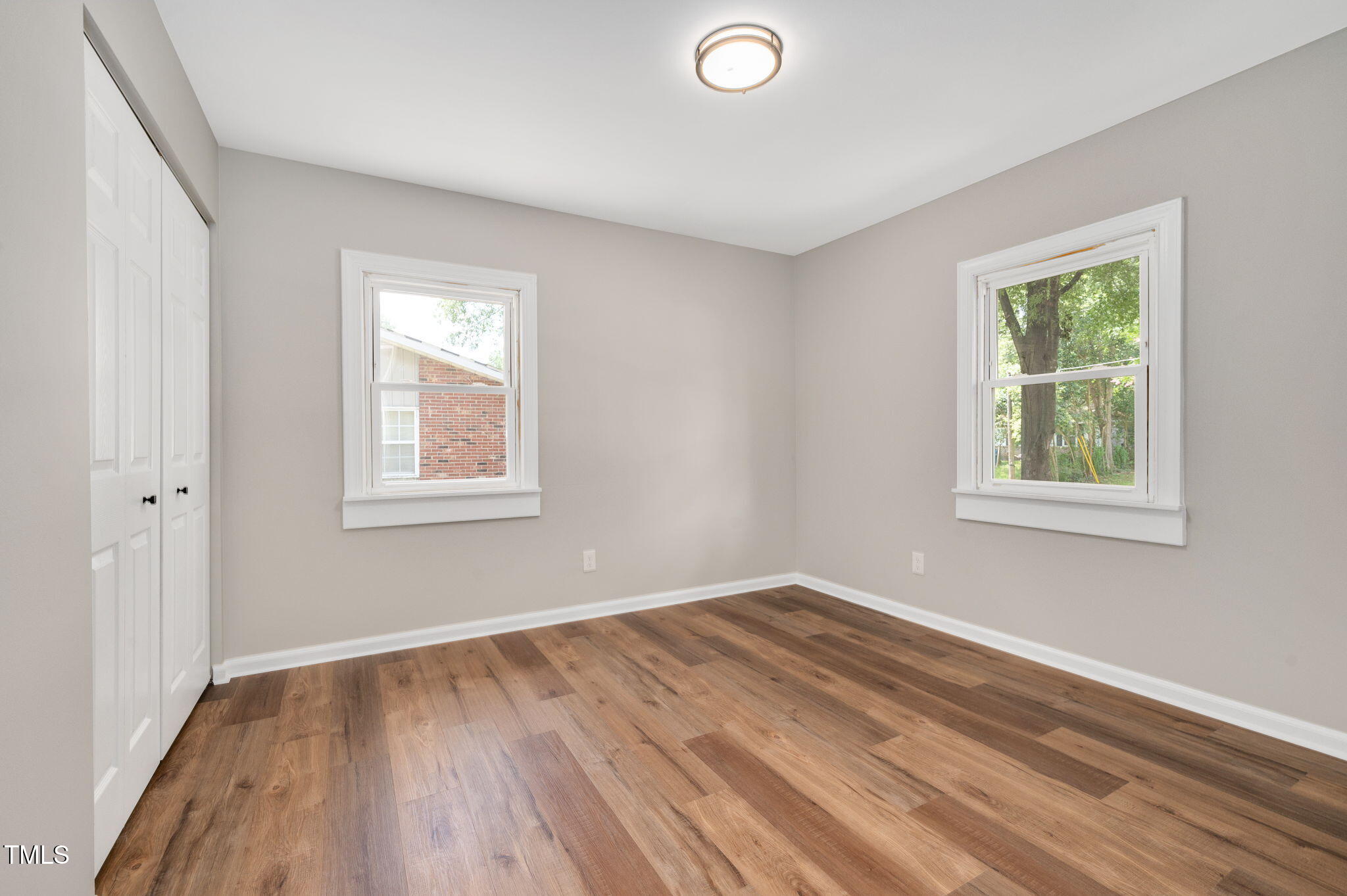 529 Solar Drive Raleigh, NC 27610 - Photo 12 of 18 a view of a room with wooden floor and windows