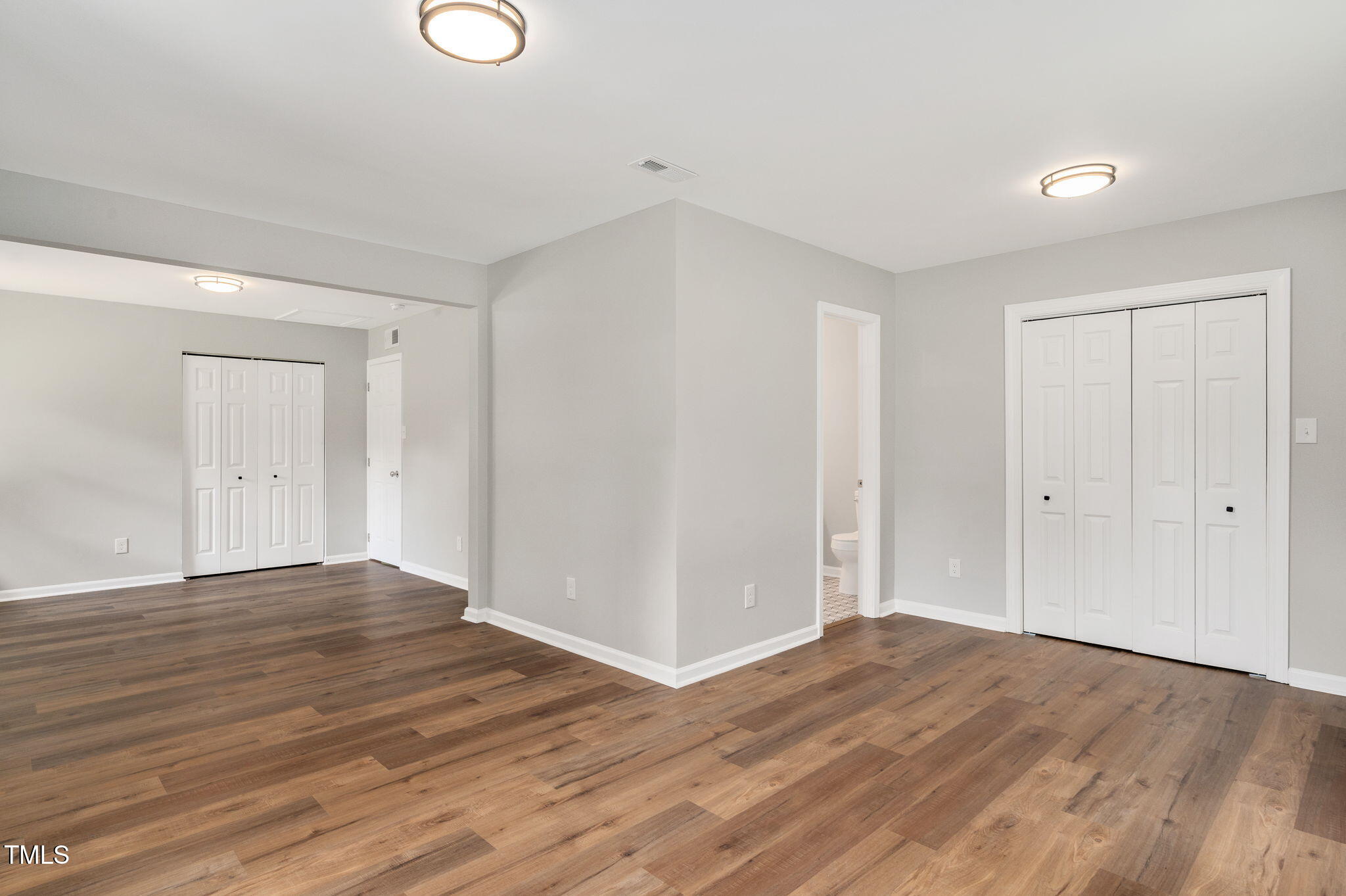 529 Solar Drive Raleigh, NC 27610 - Photo 16 of 18 a view of an empty room with wooden floor