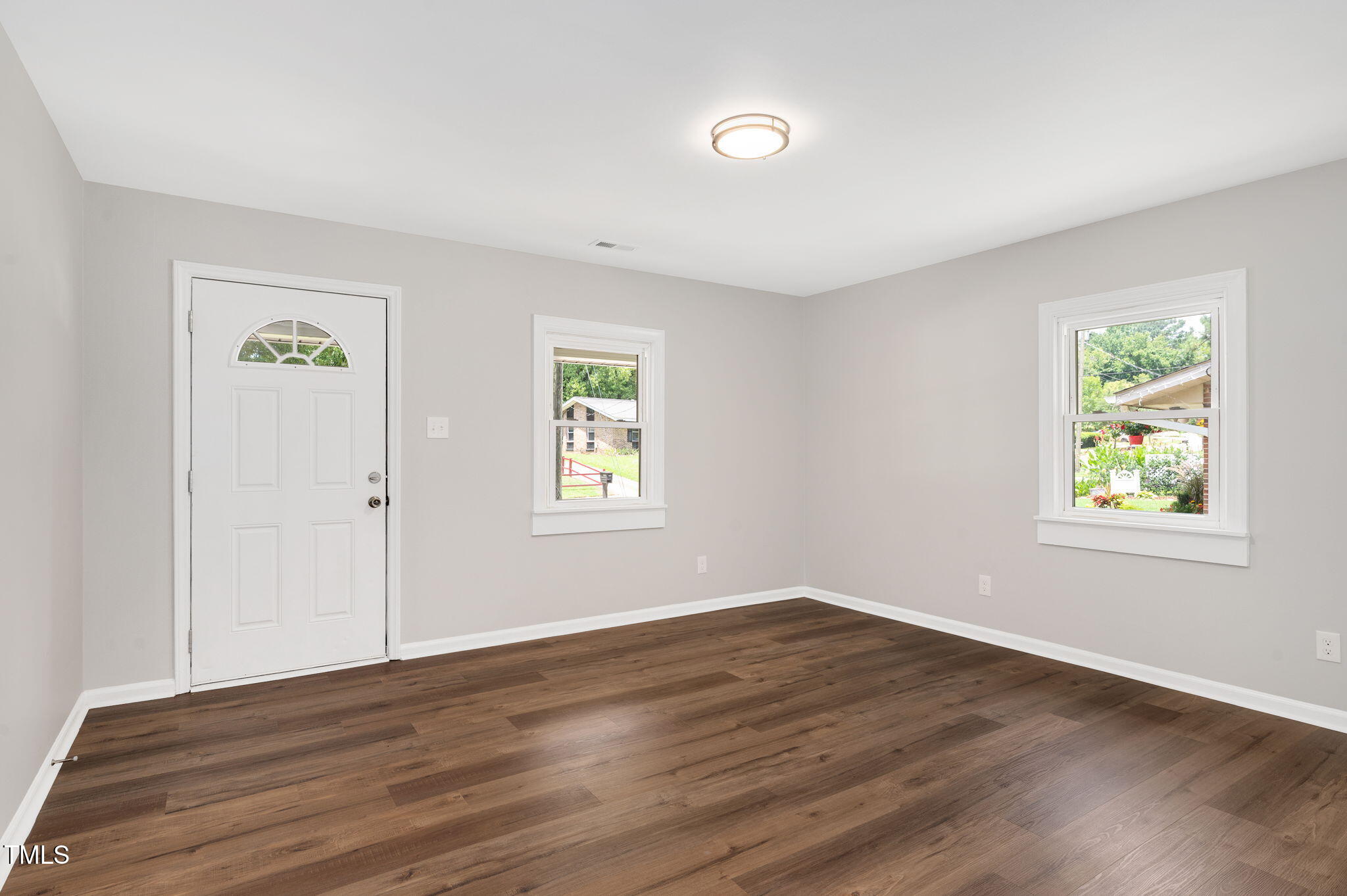 529 Solar Drive Raleigh, NC 27610 - Photo 4 of 18 a view of an empty room with wooden floor and a window