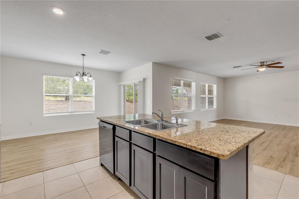 48 Hickory Loop Ocala, FL 34472 - Photo 16 of 52 a kitchen with granite countertop sink cabinets and window