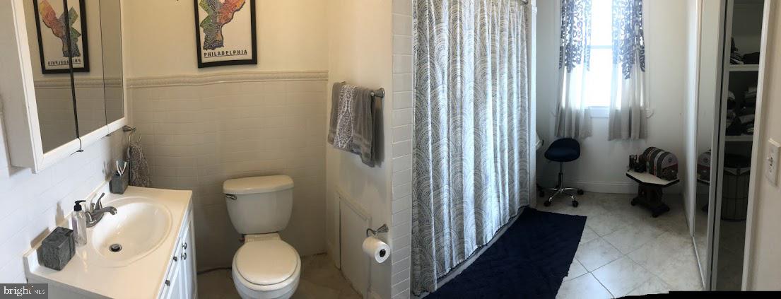 753 South 22nd Street Philadelphia, PA 19146 - Photo 13 of 22 a white toilet sitting next to a bathroom sink