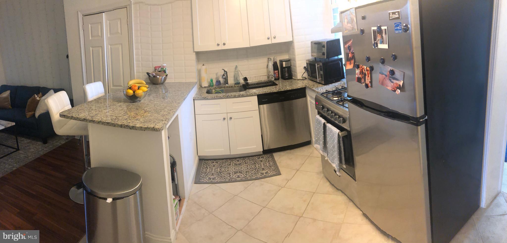 753 South 22nd Street Philadelphia, PA 19146 - Photo 15 of 22 a kitchen with a sink appliances and cabinets