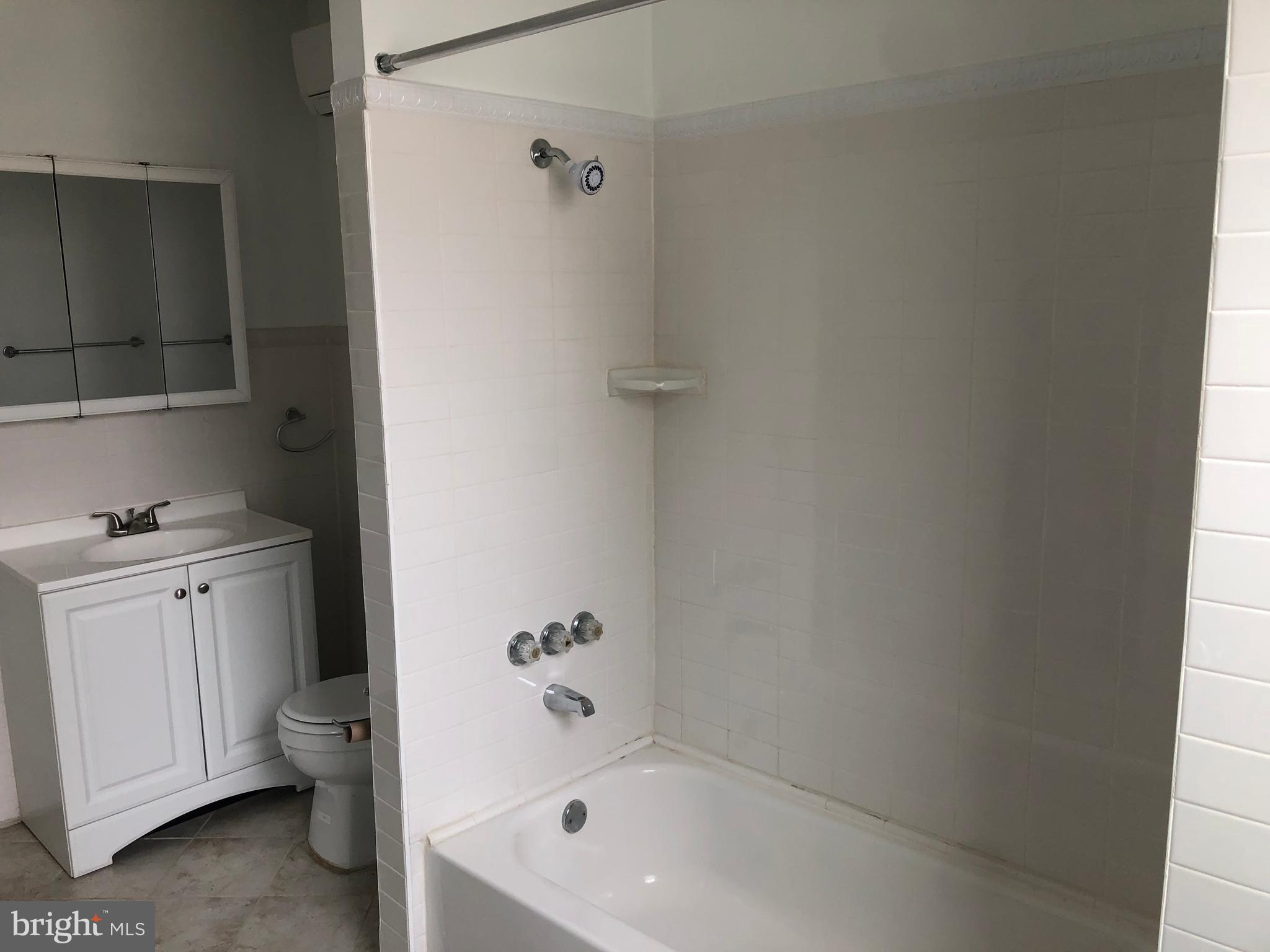 753 South 22nd Street Philadelphia, PA 19146 - Photo 17 of 22 a bathroom with a granite countertop bathtub shower sink vanity and toilet