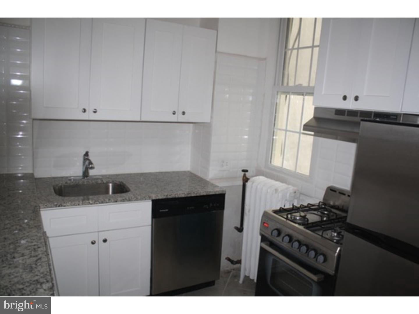 753 South 22nd Street Philadelphia, PA 19146 - Photo 4 of 22 a kitchen with a sink and cabinets