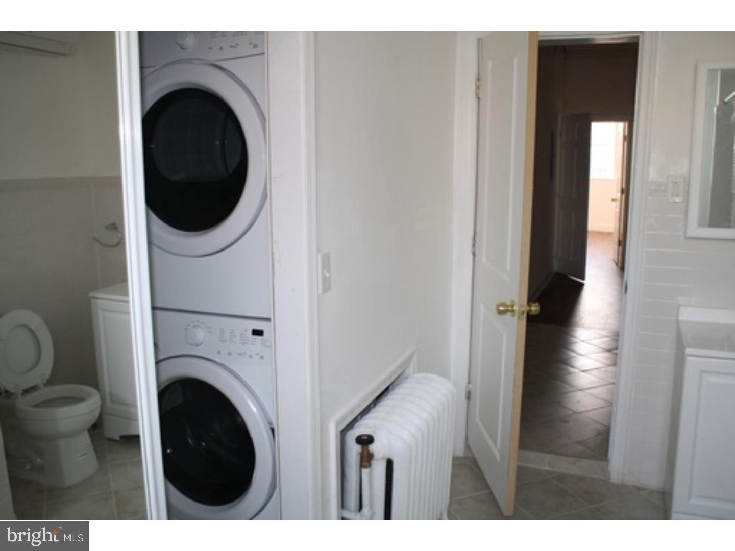 753 South 22nd Street Philadelphia, PA 19146 - Photo 9 of 22 a view of a hallway with washer and dryer