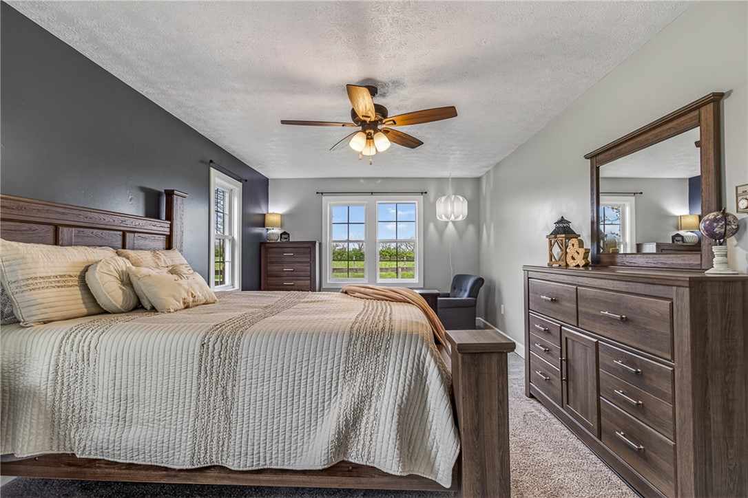 8700 Quaker Trace Road Camden, OH 45311 - Photo 15 of 34 This inviting bedroom provides a tranquil retreat with ample natural light.
