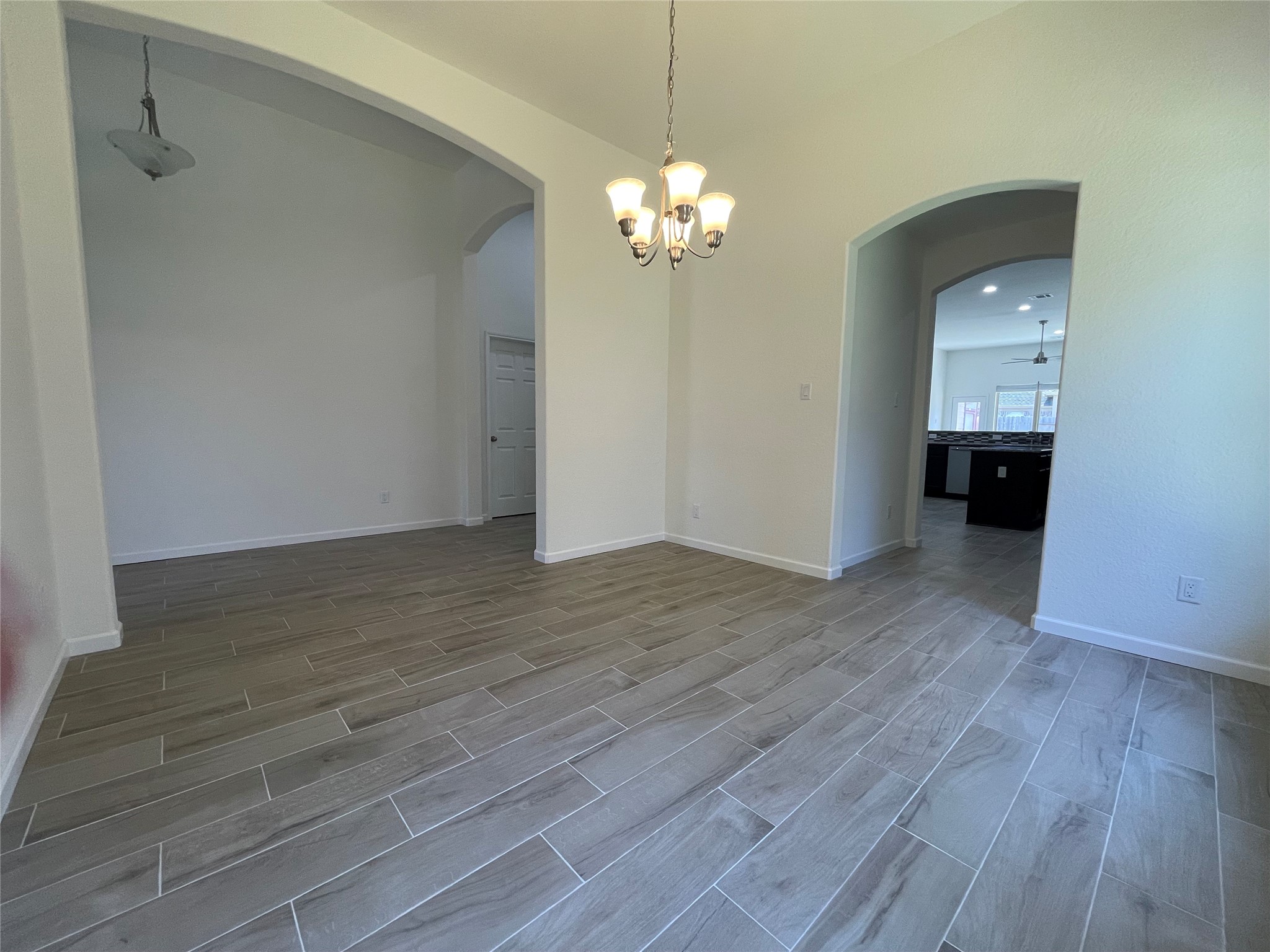 4118 Guild Meadows Drive Houston, TX 77084 - Photo 7 of 35 a view of an empty room with wooden floor