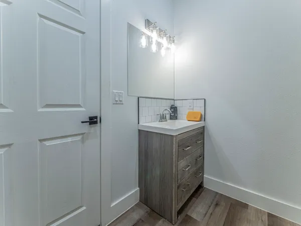 a utility room with cabinets washer and dryer