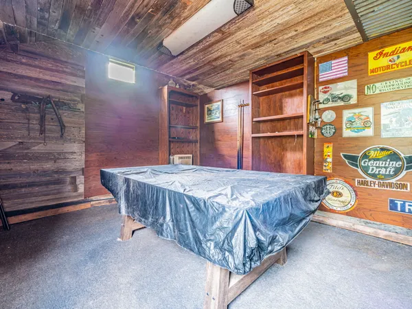 a bed sitting in a room next to a window