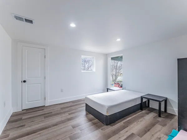 a bedroom with a bed and a table