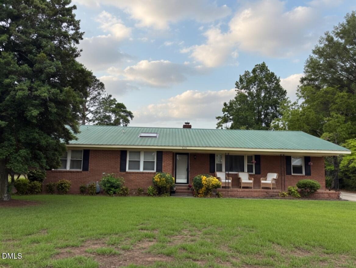 3102 Summit Road Goldsboro, NC 27534 - Photo 1 of 30 a front view of a house with garden