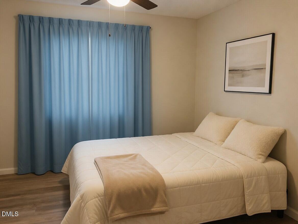 3102 Summit Road Goldsboro, NC 27534 - Photo 12 of 30 a bedroom with a bed and a painting on the wall