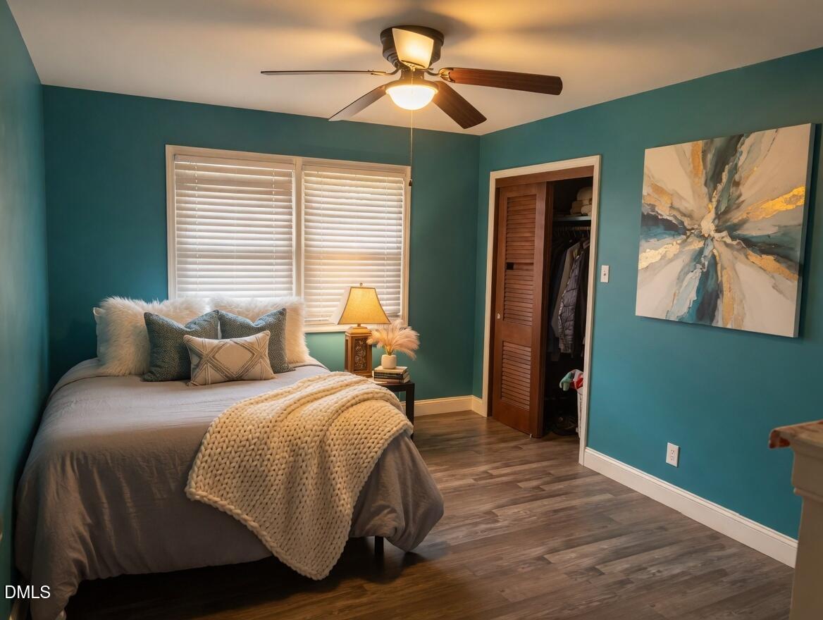 3102 Summit Road Goldsboro, NC 27534 - Photo 13 of 30 a bedroom with a bed and a chandelier