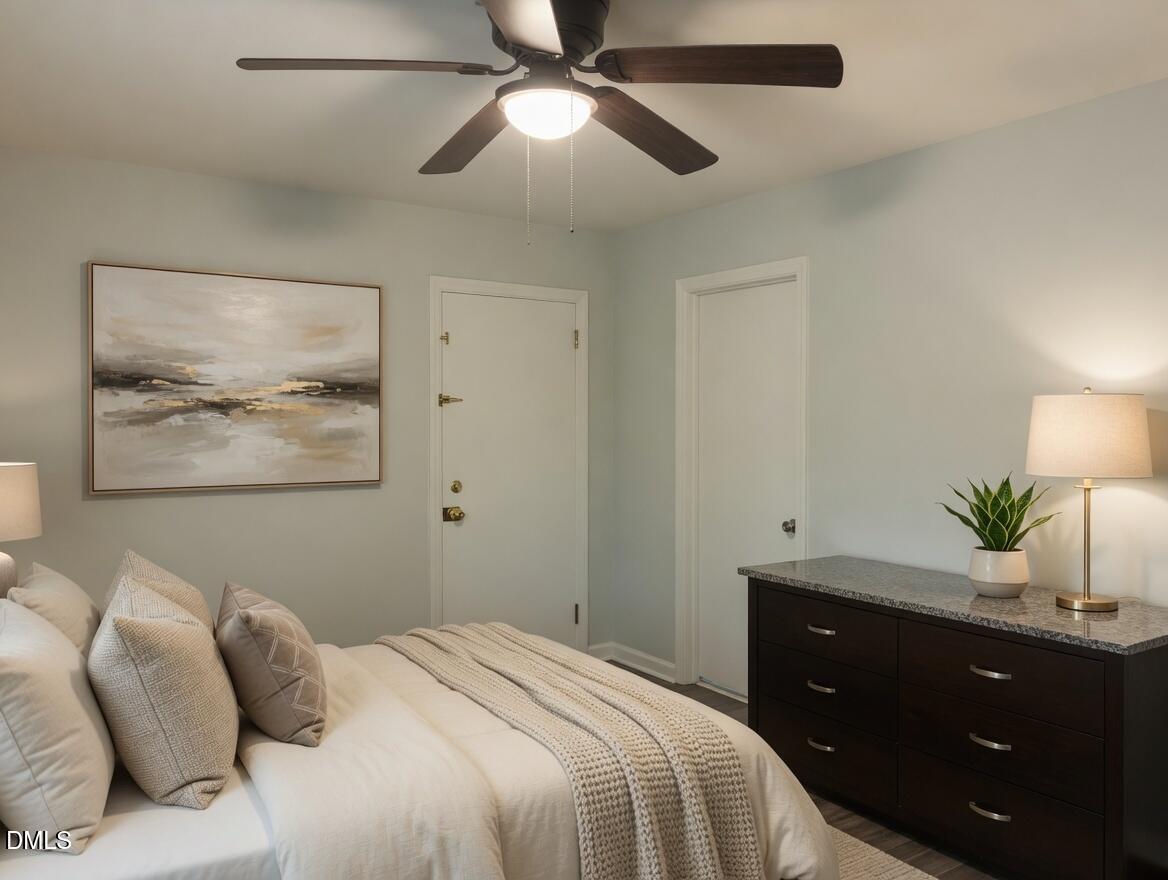 3102 Summit Road Goldsboro, NC 27534 - Photo 15 of 30 a bedroom with a bed and a chandelier