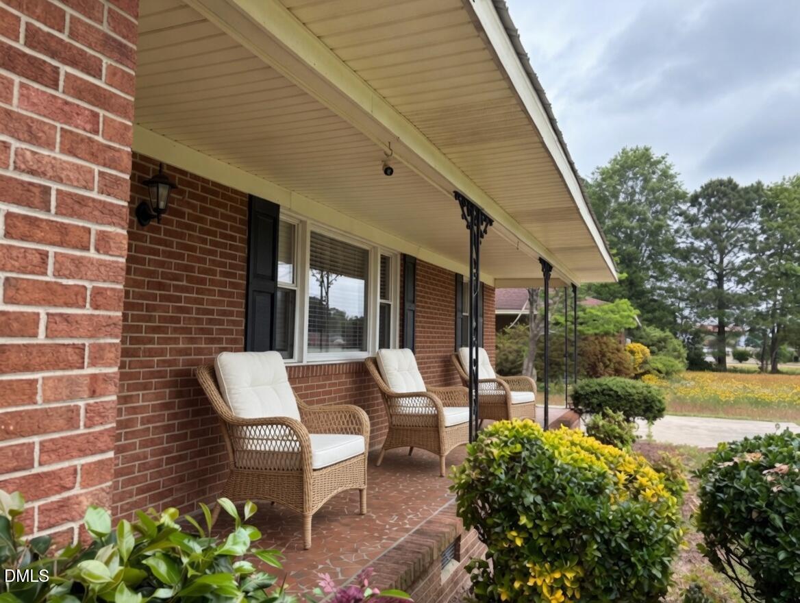 3102 Summit Road Goldsboro, NC 27534 - Photo 2 of 30 a backyard of a house with outdoor seating