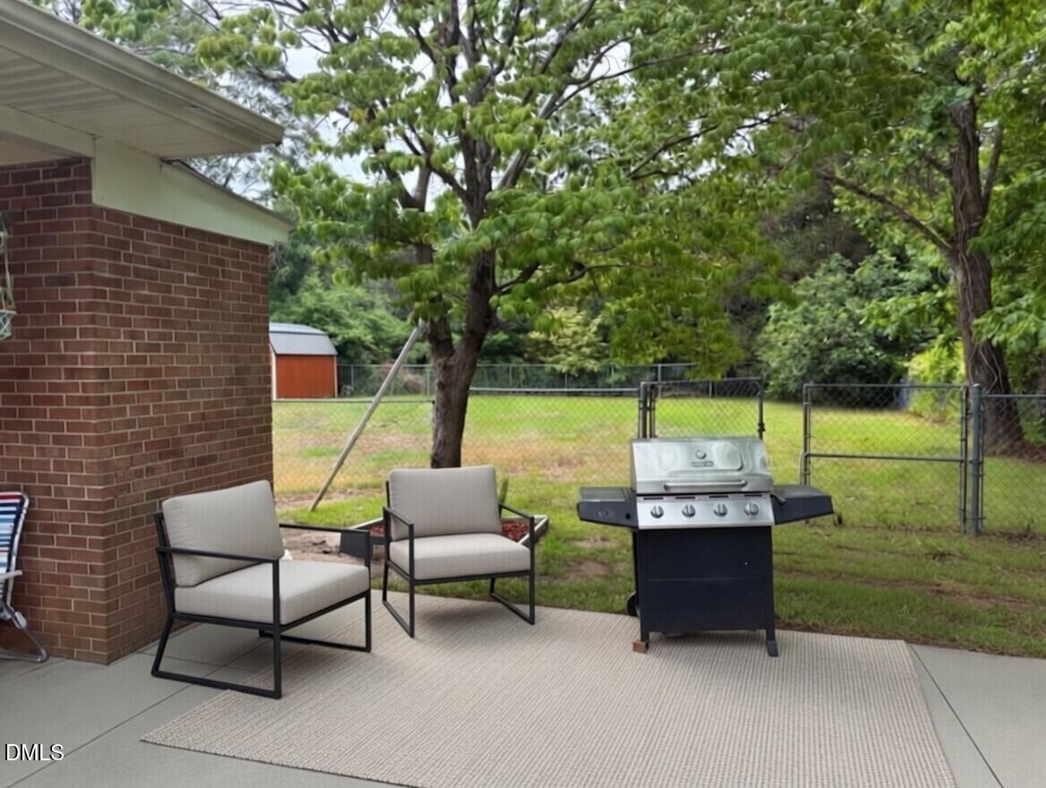 3102 Summit Road Goldsboro, NC 27534 - Photo 25 of 30 a backyard of a house with outdoor seating