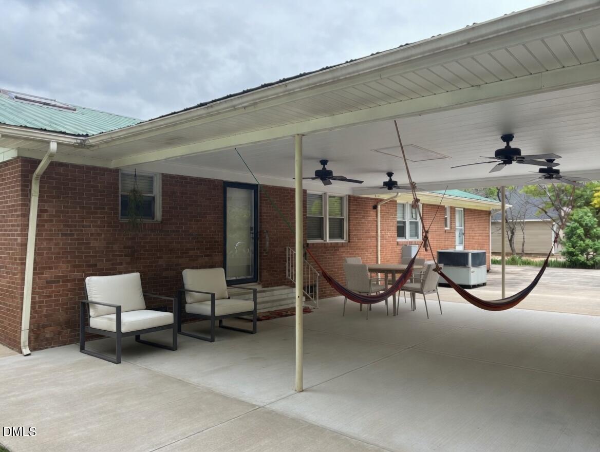 3102 Summit Road Goldsboro, NC 27534 - Photo 26 of 30 a view of a patio with table and chairs