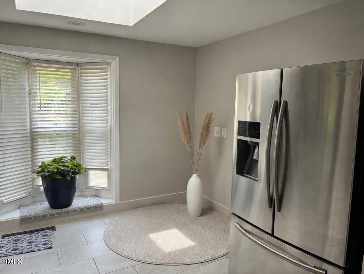 3102 Summit Road Goldsboro, NC 27534 - Photo 7 of 30 a view of a kitchen with a refrigerator and a potted plant