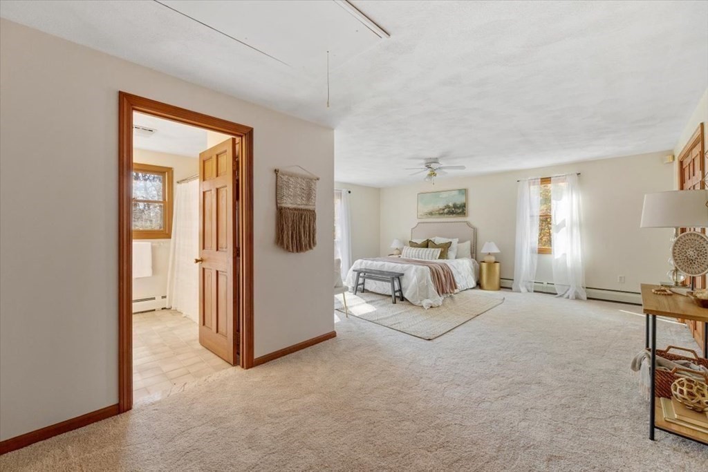 107 Ash Street Rehoboth, MA 02769 - Photo 19 of 34 a bedroom with furniture and a lamp