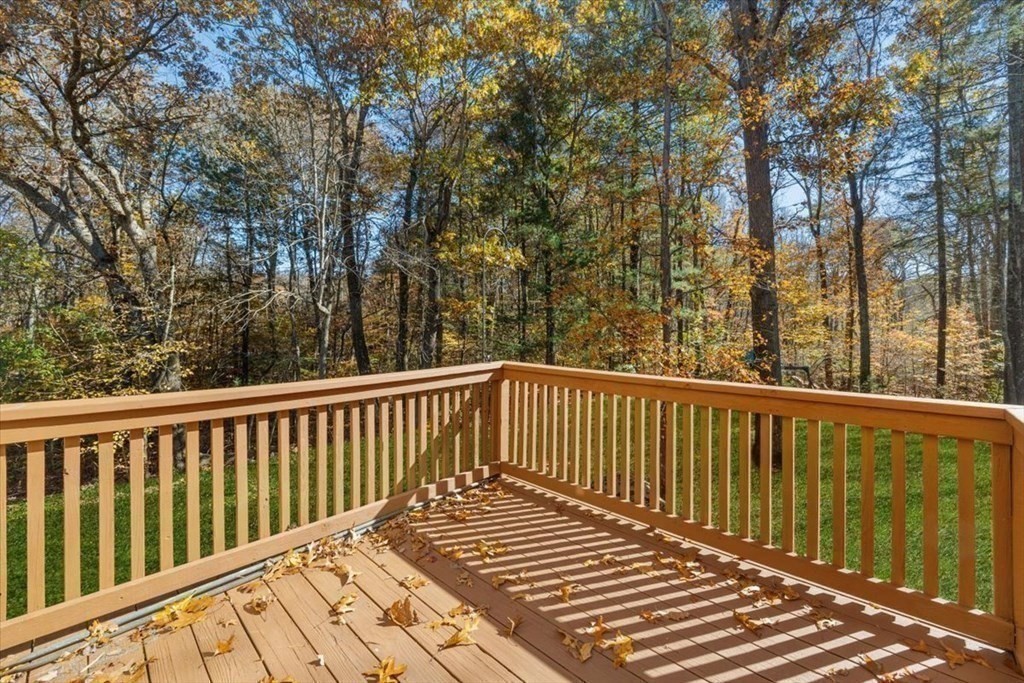 107 Ash Street Rehoboth, MA 02769 - Photo 23 of 34 a balcony with wooden floor and fence