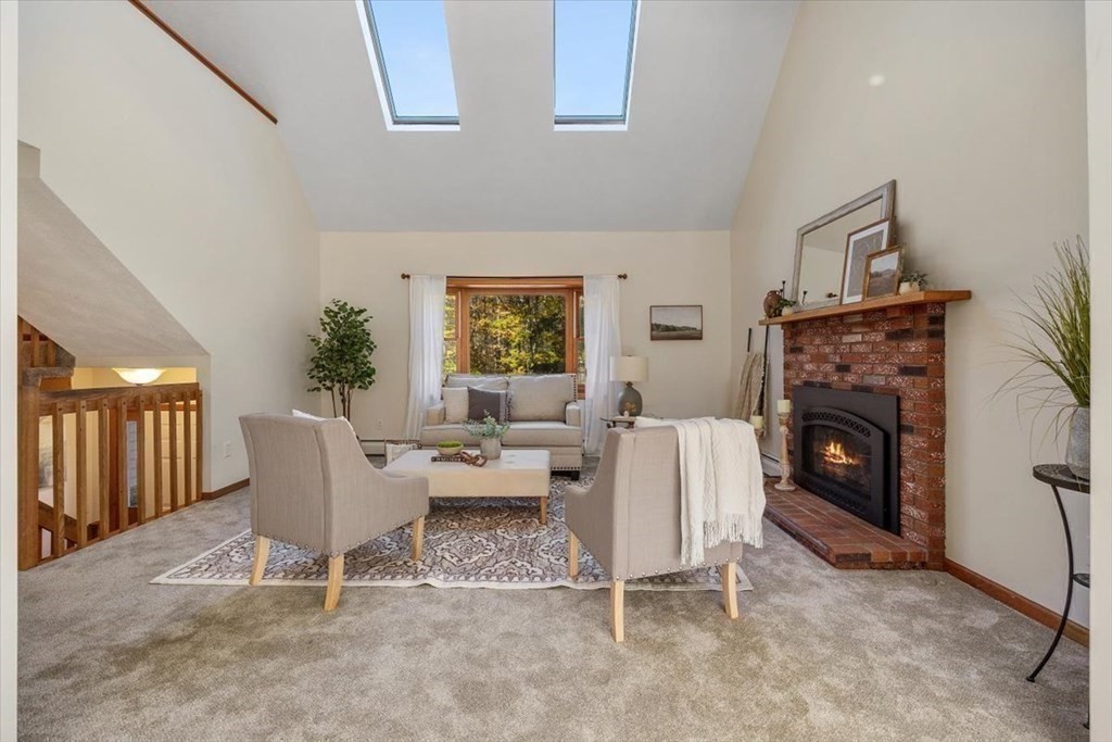107 Ash Street Rehoboth, MA 02769 - Photo 4 of 34 a living room with furniture a fireplace and a large window