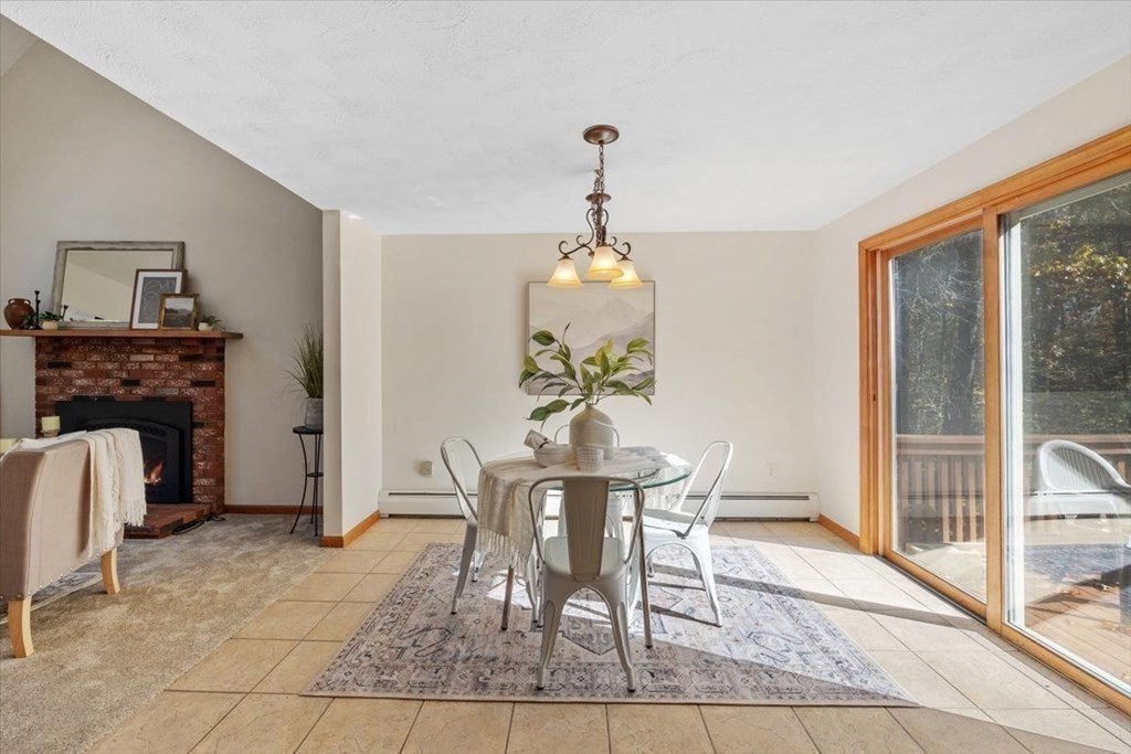 107 Ash Street Rehoboth, MA 02769 - Photo 6 of 34 a view of a dining room with furniture and a chandelier