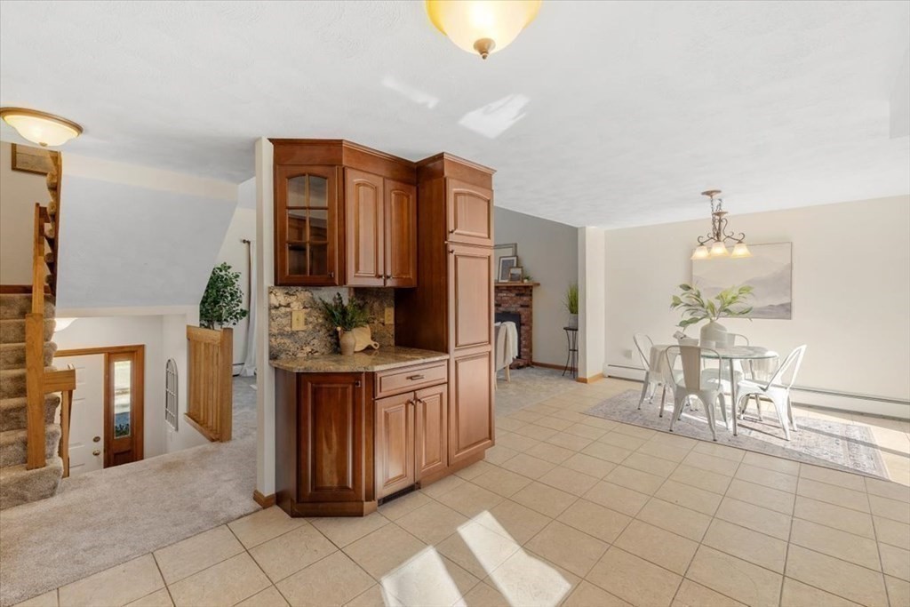 107 Ash Street Rehoboth, MA 02769 - Photo 7 of 34 a kitchen with stainless steel appliances a sink and cabinets