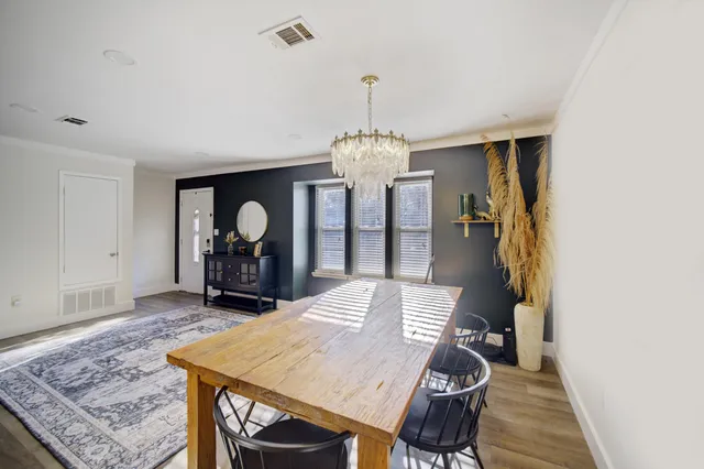 a view of a dining room with furniture and window