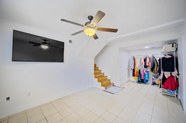 a view of a livingroom with furniture and a flat screen tv