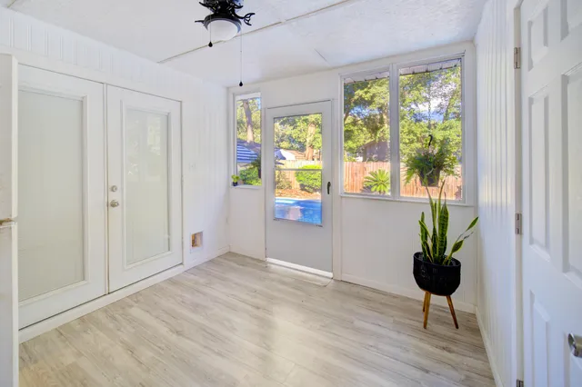 a view of an entryway with wooden floor