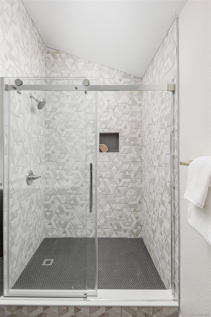 10754 West 107th Circle Westminster, CO 80021 - Photo 18 of 24 a bathroom with a shower