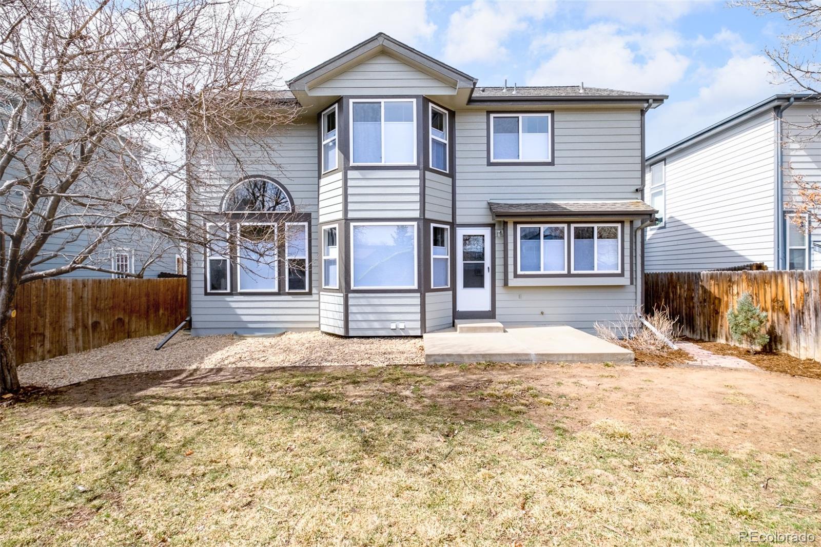 10754 West 107th Circle Westminster, CO 80021 - Photo 24 of 24 a view of a house with snow on the wall