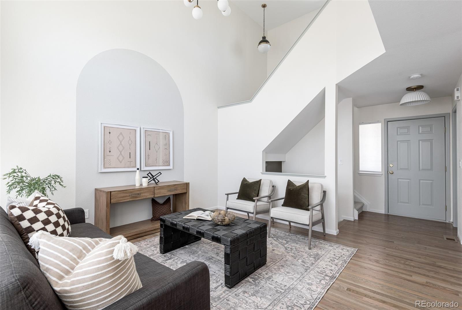 10754 West 107th Circle Westminster, CO 80021 - Photo 5 of 24 a living room with furniture and wooden floor